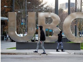 Thirty-one UBC professors have been appointed as Canada Research Chairs, an honour that has earned the school a $27.2-million boost. A man on a skateboard and a young woman pass large letters spelling out UBC at the University of British Columbia in Vancouver, B.C., on Sunday, November 22, 2015.