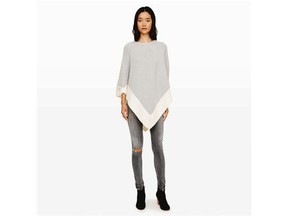 SLEEK AND SIMPLE Who says a cape has to billow loosely in the wind? This streamlined version is the epitome of sophistication, thanks to its flattering, slightly fitted shape and pared-down, minimalist hue. Club Monaco, clubmonaco.com, $525