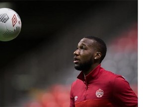 Canadian men's national soccer team forward David Junior Hoilett juggles a soccer ball with his feet during team practice in Vancouver, B.C., on Thursday November 12, 2015. Canada is scheduled to play Honduras in the opening round of CONCACAF qualifying for the 2018 World Cup in Vancouver on Friday. THE CANADIAN PRESS/Darryl Dyck
