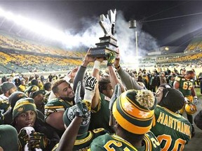 Edmonton Eskimos celebrate the win over the Calgary Stampeders during the CFL West Division final in Edmonton, Alta., on Sunday November 22, 2015. THE CANADIAN PRESS/Jason Franson.