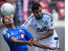 The Montreal Impact's Johan Venegas (left) and Vancouver Whitecap Steven Beitashour vie for the ball during their Amway Canadian Championship final series game at BC Place Stadium last August. Beitashour was officially traded to Toronto FC on Friday.