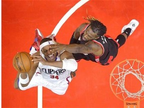 Los Angeles Clippers forward Paul Pierce, left, shoots as Toronto Raptors forward DeMarre Carroll defends during the first half of an NBA basketball game Sunday, Nov. 22, 2015, in Los Angeles. (AP Photo/Mark J. Terrill)