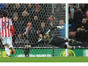 Arsenal’s goalkeeper Petr Cech saves a long range shot during the English Premier League soccer match between Stoke City and Arsenal at the Britannia Stadium, Stoke on Trent, England, Sunday, Jan. 17, 2016. (AP Photo/Rui Vieira)