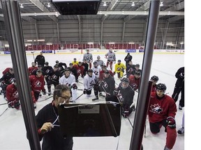 Kelly McCrimmon lays out a play on the board during a Canadian World Junior Hockey team practice in Toronto on Thursday, December 11, 2015.