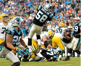 Carolina Panthers' Cam Newton runs with the ball during their game against the Green Bay Packers.