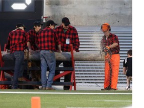 After every Redblacks touchdown, members of the Algonquin College Loggersports Team cut a wood cookie from a log in the end zone.