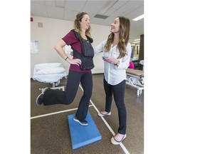 Siobhan Karam demonstrates the Brock String Test as a part of a demonstration of a concussion exam on Jenny Dea, also a physiotherapist at Sports Medicine Specialists clinic in Toronto, Ont.