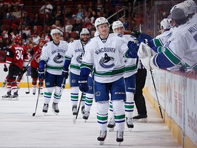 Canucks rookie Jared McCann celebrates with teammates on the bench after scoring a goal earlier this season in Arizona against the Coyotes. McCann, who will be back in the team's lineup tonight after being sat out last game against Anaheim, derives some confidence from getting on the scoresheet the last time the Canucks and the Desert Dogs met. 'Knowing that I did score before, it gives me more confidence that, hey, I can get more chances tonight and put pucks to the net and that type of thing,' he says.