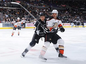 Milan Lucic #17 of the Los Angeles Kings skates against Kevin Bieksa #2 of the Anaheim Ducks at STAPLES Center on September 29, 2015 in Los Angeles, California.