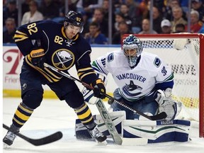 Matt Moulson of the Buffalo Sabres chases the puck against Daniel Sedin of the Vancouver Canucks during the teams' meeting in Buffalo earlier this season, a game won 3-2 by the Sabres. The teams meet again Monday in Vancouver.