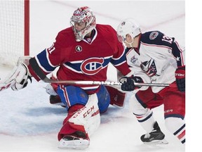 MONTREAL, QUE.: MARCH  30, 2015 -- Montreal Canadiens goalie Carey Price follows flying puck, during second period NHL action in Montreal on Monday March 30, 2015. (Pierre Obendrauf / MONTREAL GAZETTE)