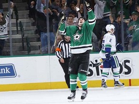 Jamie Benn #14 of the Dallas Stars celebrates an overtime goal against the Vancouver Canucks at the American Airlines Center on October 29, 2015 in Dallas, Texas.