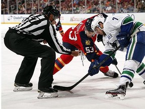 Linden Vey #7 of the Vancouver Canucks faces off against Corban Knight #53 of the Florida Panthers at the BB&T Center on December 20, 2015 in Sunrise, Florida.