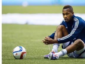 Vancouver Whitecaps' Kendall Waston ties up his boot before playing the L.A. Galaxy in a  MLS soccer game at BC Place Stadium.