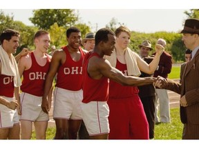 Stephan James, centre, as Jesse Owens, and Jason Sudeikis, as coach Larry Snyder, are aptly paired in Race.