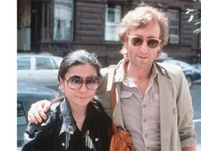 John Lennon, right, and his wife, Yoko Ono, arrive at The Hit Factory, a recording studio in New York on Aug. 22, 1980, the year Lennon was murdered. (Steve Sands/The Associated Press)