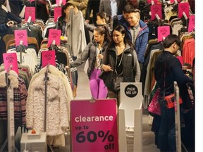The streets and shopping malls were filled with bargain-hunting shoppers, such as at The Bay on Granville Street in downtown Vancouver, BC, for the annual Boxing Day sales Saturday, December 26, 2015.