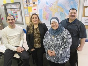 Iraqi refugees Zaenab Mahammed (second from left) and her husband Ahmed Sadik (far right) with friend and fellow Iraqi refugee Jabar Karnawe (far left) and interpreter Sireen El-Nashar (second from left) at SUCCESS in Surrey, Thursday, January 21, 2016.