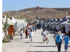 Syrian Refugee children go about their daily lives at the refugee camp in Osmaniye, Turkey. The St. Gregory Armenian Apostolic Church will welcome three Syrian refugee families on Tuesday and as many as 80 more over the next five weeks.