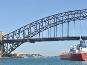 A tanker sails under Sydney Harbour Bridge after arriving in Australia. Almost a month after Canada and 11 other nations reached an agreement on the Trans-Pacific Partnership, Canadians remain sharply divided about the trade deal.