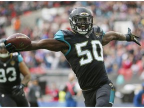 Telvin Smith #50 of Jacksonville Jaguars scores a touchdown in the second quarter on an interception in the second quarter during the NFL game between Jacksonville Jaguars and Buffalo Bills at Wembley Stadium on October 25, 2015 in London, England.