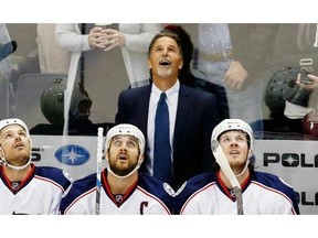 Things are beginning to look up for Columbus Blue Jackets new head coach John Tortorella, top, who was out of work for more than a year after being fired by the Canucks.