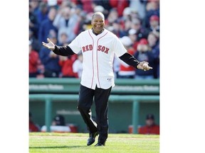 This Oct. 11, 2009 file photo shows former Boston Red Sox outfielder Dave Henderson walking onto the field to throw out the ceremonial first pitch before Game 3 of an American League baseball division series between the Boston Red Sox and Los Angeles Angels in Boston. Henderson, who hit one of the most famous home runs in postseason history, died Sunday, Dec. 27, 2015, after suffering a massive heart attack. He was 57.