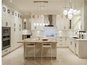 This Springthorne Crescent home has a kitchen with Shaker-style cabinets, undermount task lighting, oversized appliances and a wine bar.