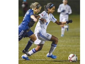 UBC Thunderbirds Jasmin Dhanda, right, and TWU Spartans Amy Gartke battle for the ball during the final of the 2015 CIS Women?s Championshp Tournament at Thunderbird Stadium on Sunday. UBC won 3-0 for the sixth national championship in their history.TRAX #: 00040169A