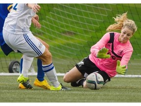 UBC Thunderbirds keeper Olivia de Goede makes a save against the University of Victoria. De Goede spent four seasons with UVic before transferring to UBC. Photo courtesy of Richard Lam/UBC Athletics.