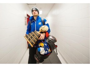 UBC Thunderbirds quarterback Michael O’Connor walks to the bus with his MVP trophy after defeating the University of Montreal Montreal Carabins during the 51st Annual Vanier Cup football action at Laval University in Quebec, QC, November, 28, 2015.