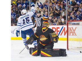 Toronto Maple Leafs #15 Pierre-Alexander Parenteau celebrates the Leafs goal on Vancouver Canucks goalie Ryan Miller in the second period of a regular season NHL hockey game at Rogers Arena, Vancouver, February 13 2016.