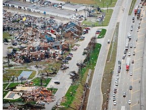 Traffic backs up along I-30, right near a site of Saturday’s tornado in Garland, Texas, Sunday, Dec. 27, 2015. At least 11 people died and dozens were injured in apparently strong tornadoes that swept through the Dallas area and caused substantial damage this weekend.