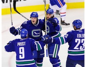 Vancouver Canucks celebrate their early 1st period goa by 91 Jared McCann   as they battle the Montreal Canadiens in Rogers Arena   in Vancouver on October 27 2015.