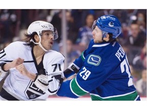 Vancouver Canucks defenceman Andrey Pedan (29) fights with Los Angeles Kings centre Jordan Nolan (71) during first period NHL action Vancouver, B.C. Monday, Dec. 28, 2015.