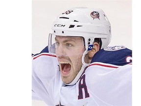 Vancouver Canucks #53 Bo Horvat skates away as Columbus Blue Jackets #38 Boone Jenner celebrates his goal on Ryan Miller in the third period of a regular season NHL hockey game at Rogers Arena, Vancouver, February 04 2016.