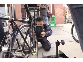 Vancouver community safety officers spent Monday outside police headquarters on Cambie Street where a station was set up to register bikes in the 529 Garage database.