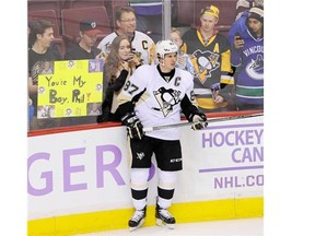 Vancouver fans watch Sidney Crosby  87, warm up as the Pittsburgh Penguins gers set to play the Canucks at Rogers Arena in Vancouver  on November 4,  2015.