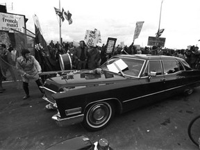Vancouver Mayor Tom Campbell’s limo edges through a crowd of protesters at the opening of the Georgia Viaduct Jan. 9, 1972.