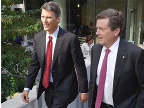 Vancouver Mayor Gregor Robertson (left) and his Toronto counterpart John Tory. Toronto has done a better job of keeping municipal spending under control, says the CFIB.