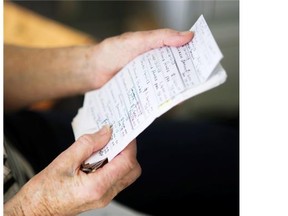 Margaret Fannin, 85, looks through paperwork she has accumulated while being defrauded out of $300,000 by a lottery scammer from California, Vancouver October 27 2015.