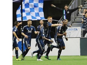 Vancouver Whitecaps celebrate their 2nd goal of the game against the Houston Dynamo in BC Place in Vancouver on October 25, 2015.