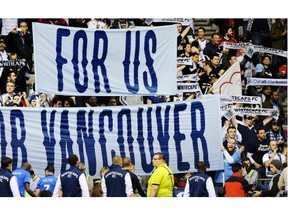 Vancouver Whitecaps fans go wild for their team as walk onto the field at the start of the game with the Montreal Impact. battle in Canadian Amway Championship  at B.C. Place stadium in Vancouver on May 29 , 2013.  The game is the final in the Amway Canadian championship