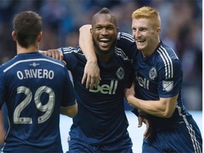 Vancouver Whitecaps’ Kendall Waston, centre, celebrates his goal with teammates Tim Parker, right, and Octavio Rivero. Waston was named the BMO Player of the Year in a fan vote earlier in the day.