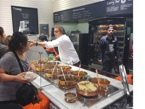 Vikram Vij, serving his curries at Loblaw’s CityMarket in North Vancouver.