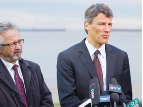 Vision Vancouver councillor Geoff Meggs, pictured with Vancouver Mayor Gregor Robertson, introduced a new fee structure for permitting applications.