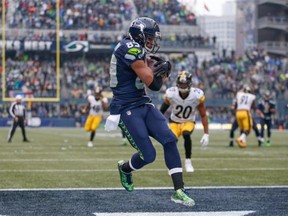 Wide receiver Doug Baldwin #89 of the Seattle Seahawks scores a touchdown against the Pittsburgh Steelers at CenturyLink Field on November 29, 2015 in Seattle, Washington.