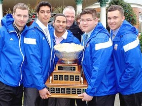 Cup-winning UBC Thunderbirds Michael O’Connor, Vikaram Varpaul, Terrell Davis, coach Blake Nill, peekaboo Mitchell Barnett, Levi Hua and Spencer Moore took the trophy and loads of gifts to Canuck Place Children’s Hospice.