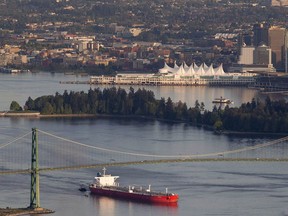 A oil tanker goes under the Lions Gate Bridge at the mouth of Vancouver Harbour on May 5, 2012.