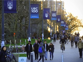 UBC glows in the late evening light while students walk in around the campus.